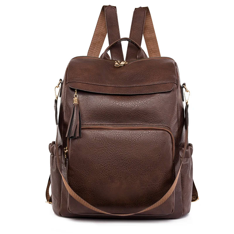 A brown vintage tassel backpack with anti-theft features is shown from the back.