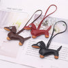 A brown dachshund leather keychain charm is displayed on a page titled Time Hot List.