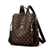 A brown genuine leather women's backpack with gold hardware and a repeating logo pattern.