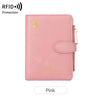 A pink multi-functional PU leather passport wallet with a gold logo and zipper pull.