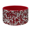A red silicone boot sleeve for water bottles with a sparkly silver and red pattern.