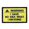 A yellow warning patch with black text that reads WARNING I HAVE NO IDEA WHAT I AM DOING