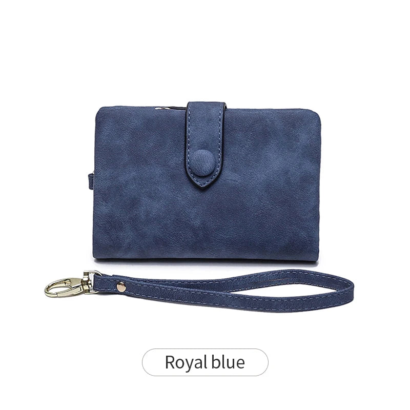A royal blue women's multi-slot frosted card wallet with a leather strap.
