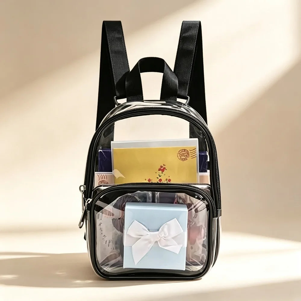A black clear PVC backpack storage pouch with black straps, holding various small items.