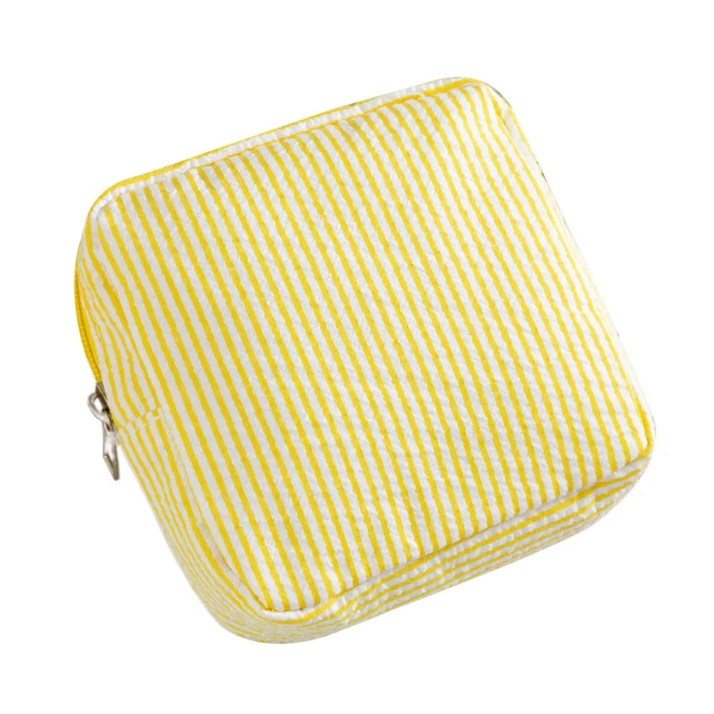 Yellow and white striped multi-functional storage pouch.