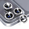 A close-up of a glitter diamond camera lens protector with a metal frame for an iPhone, showing multiple lenses.