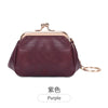 A deep purple leather coin purse with a gold-toned clasp and keychain attached.