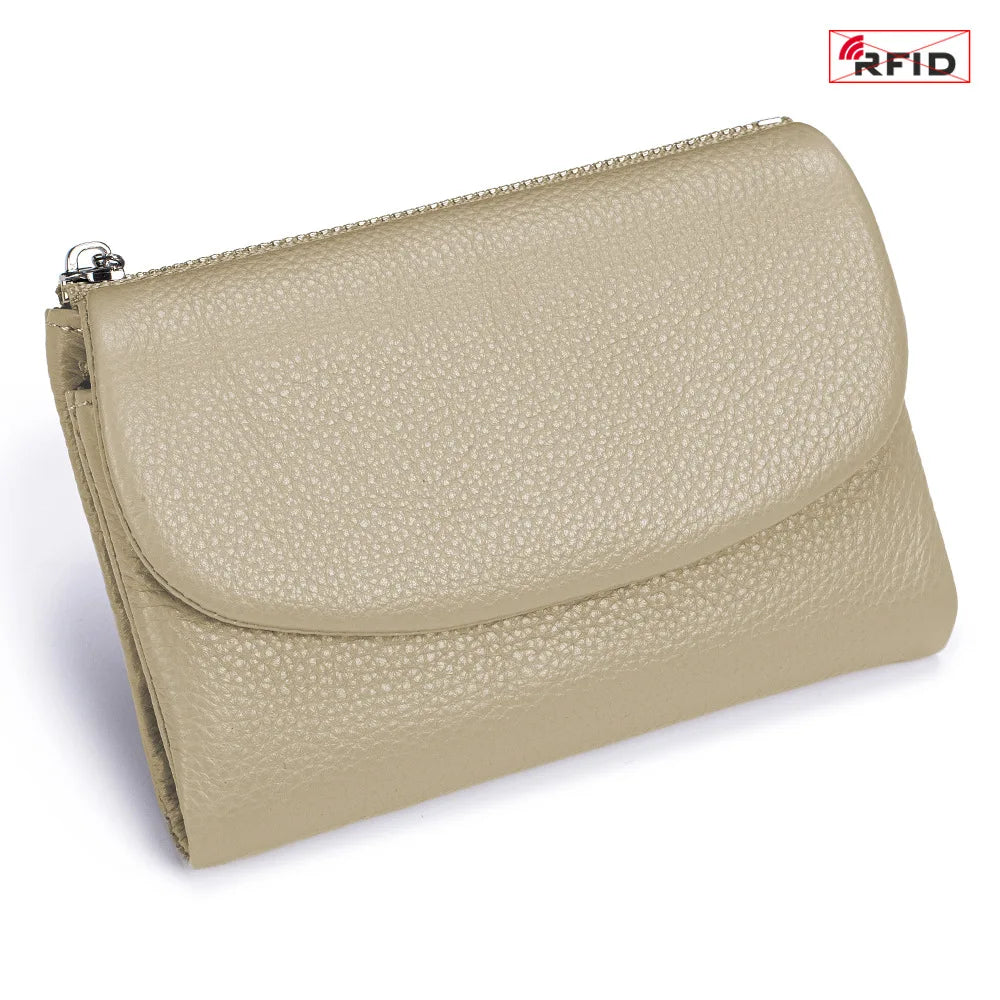 A beige genuine leather mini card holder wallet with a zipper closure.