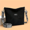 Sac à épaule et bandoulière côtelé en velours de coton noir avec sangle à motifs noir et blanc