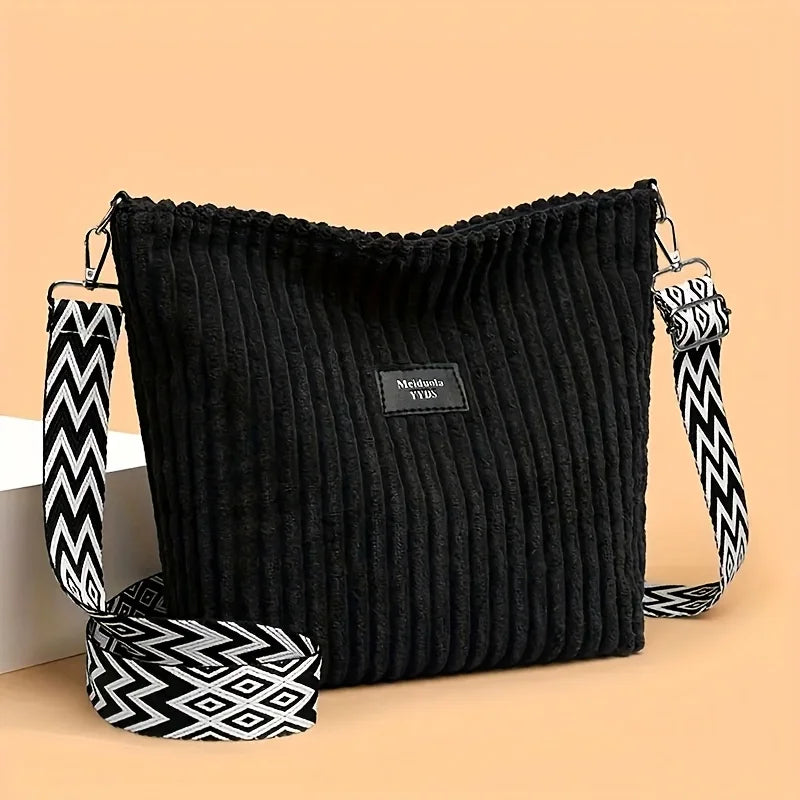 Sac à épaule et bandoulière côtelé en velours de coton noir avec sangle à motifs noir et blanc