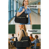 A woman in a blue shirt carries a black insulated laptop lunch tote in a clinical setting.
