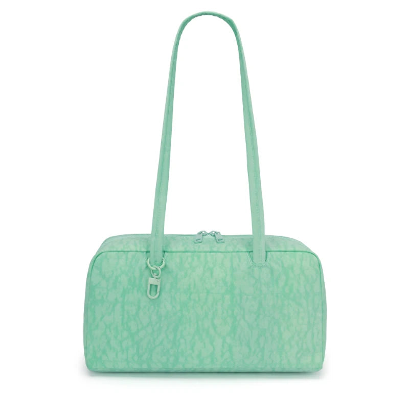 A mint green leopard print nylon shoulder tote bag with a long strap.