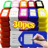 A stack of colorful customizable luggage tags in various shades including green, pink, orange, purple, blue, and yellow.