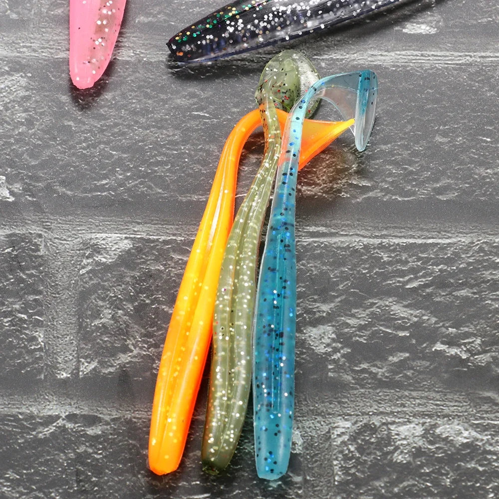 A collection of colorful adjustable soft lure fishing tackle, including orange, green, and blue lures.