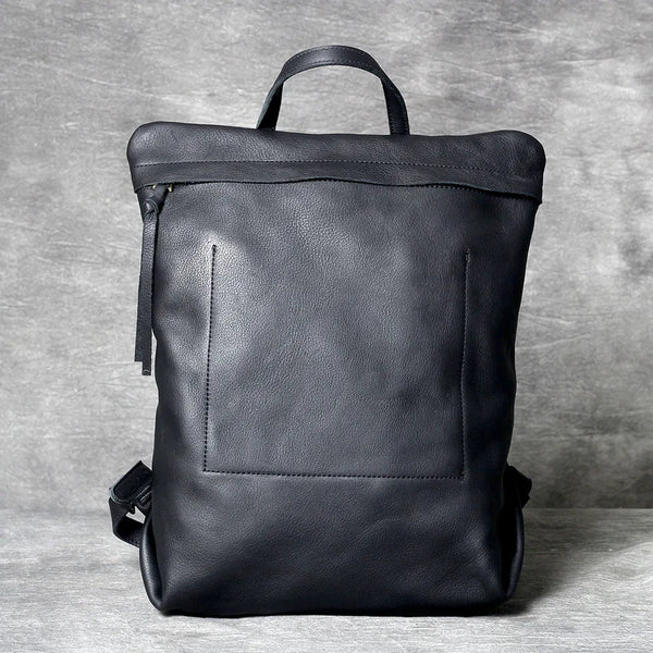 A black genuine full-grain leather backpack shown from the back.
