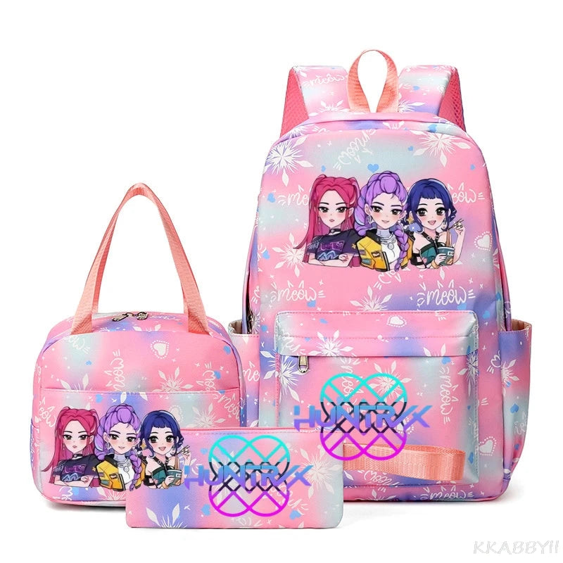 A pink multi-compartment backpack set featuring anime-style characters on a floral pattern.