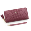 A mauve quilted PU leather clutch wallet with a gold chain and matching strap.