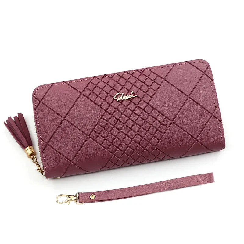A mauve quilted PU leather clutch wallet with a gold chain and matching strap.