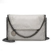 A silver gray vintage flap crossbody bag featuring a chain strap and silver hardware.