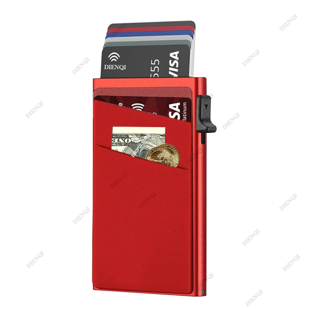 A red metal card holder with a slot for cards and a visible stack of credit cards.