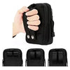 A hand holds a black tactical EDC waist pouch belt designed for carrying phones and tools.