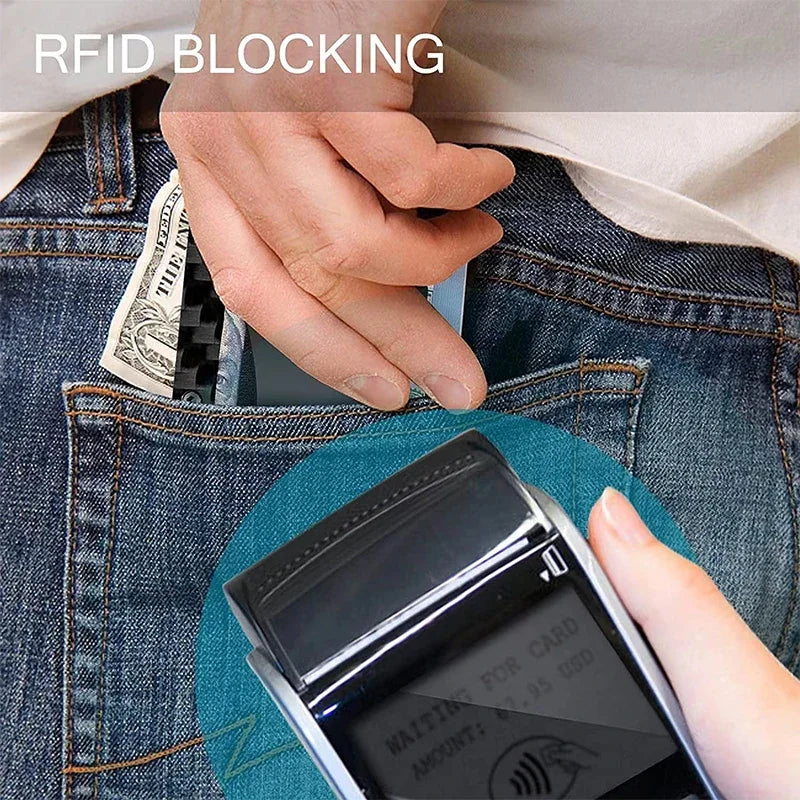 A hand is placing a card into a slim metal RFID protection card holder wallet inside a denim pocket.
