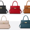 A row of five luxury women's handbags in black, red, brown, beige, and teal.