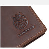 A brown genuine leather passport and travel wallet featuring an embossed lion design and the word SCHLATUM.