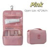 Pink waterproof makeup organizer with multiple compartments and a separate travel pouch
