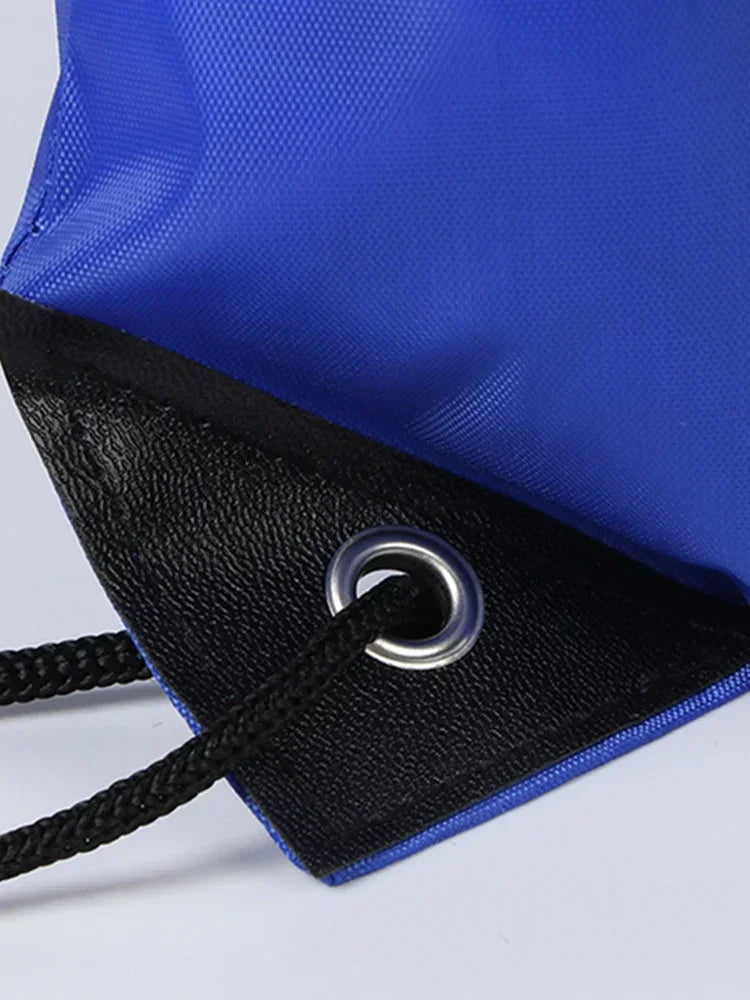 Blue and black gym drawstring backpack with a silver grommet detail