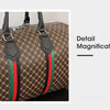 Close-up detail of a women's plaid travel duffle bag featuring brown and green fabric with black leather straps.