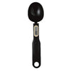 A black precision digital kitchen scale with a round weighing bowl and a digital display.