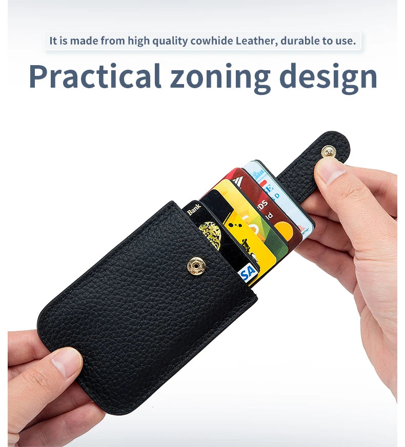 A hand holds a black leather slim card holder displaying various credit cards and an ID.