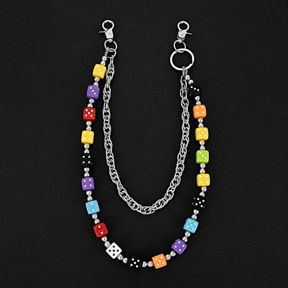 A silver chain necklace featuring colorful dice charms in various colors like yellow, purple, red, and black.