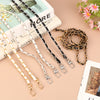 Various adjustable leather chain straps in gold and black colors laid out on a light background.