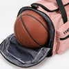 A pink tactical backpack with a black mesh pocket containing a brown basketball.