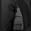 A black lightweight nylon crossbody sling bag worn on a person's shoulder.