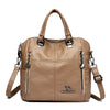 A tan leather fashion crossbody backpack bag with silver hardware.