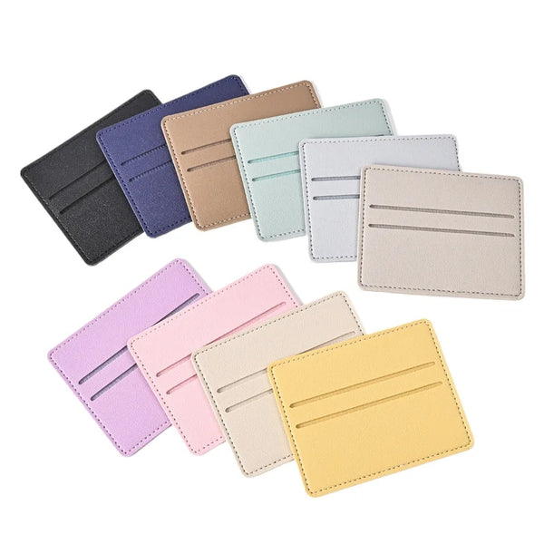 A collection of ten PU leather card holders in various pastel and neutral colors arranged diagonally.