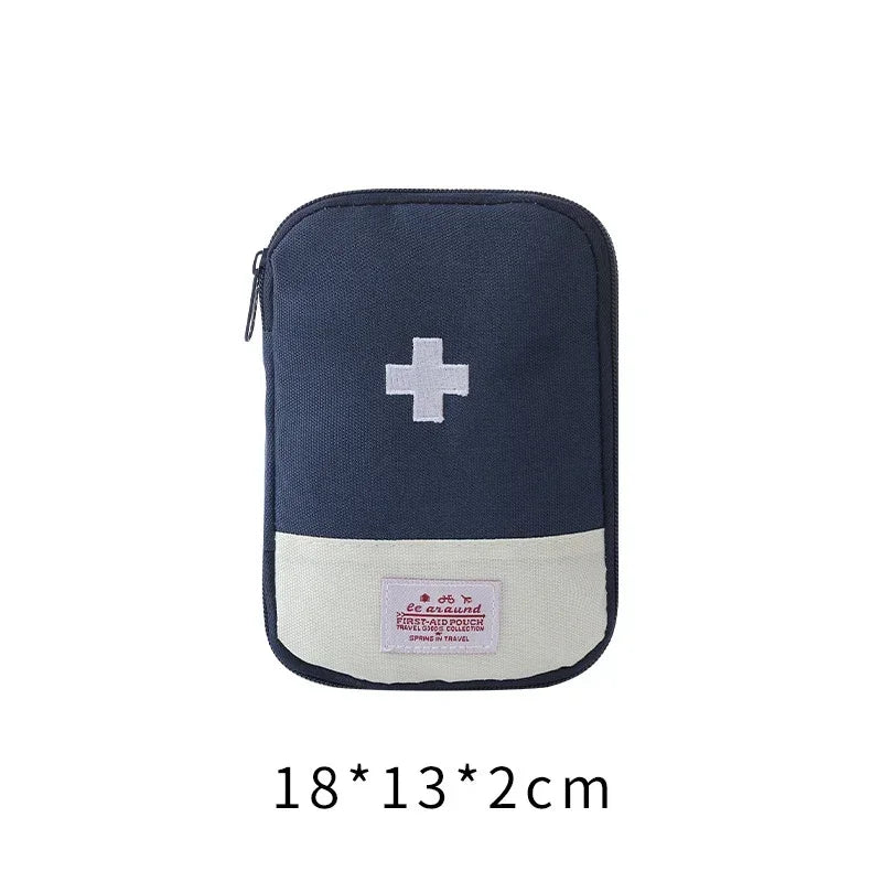 Navy blue portable first aid kit storage bag with a white cross emblem and beige trim.