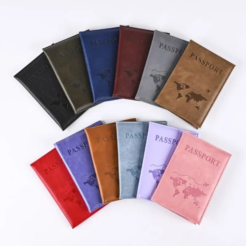 A collection of elegant pink leather passport holders in various shades including blue, brown, and gray.