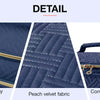 Detail shot of a navy blue cosmetic organizer bag showing double-way zippers, peach velvet fabric, and a convenient carry han