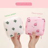 A pink hygiene storage bag featuring a peach pattern and a white one with a cactus pattern.