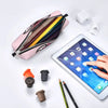 A pink leather pencil case is shown open with several colored pencils inside, next to a tablet and some writing tools.