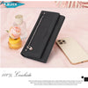 A black genuine leather wallet is shown next to a smartphone on a pink background.