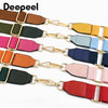 A collection of colorful canvas cotton bag straps with metal hooks displayed horizontally.