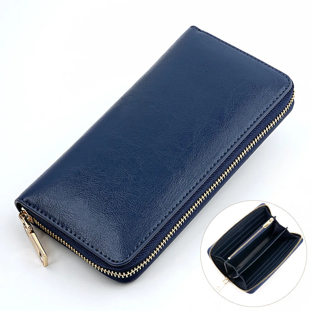 A navy blue genuine leather zipper wallet shown open and closed, with a close-up view of the interior.