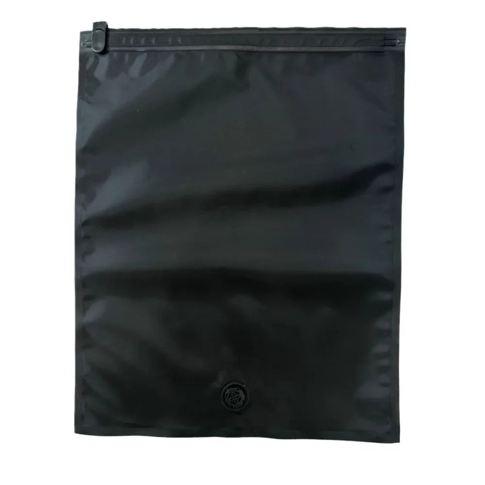 A black reusable vacuum storage bag with a sealed top and a circular closure.