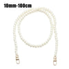 A strand of white pearls used as a strap for a handbag or purse.