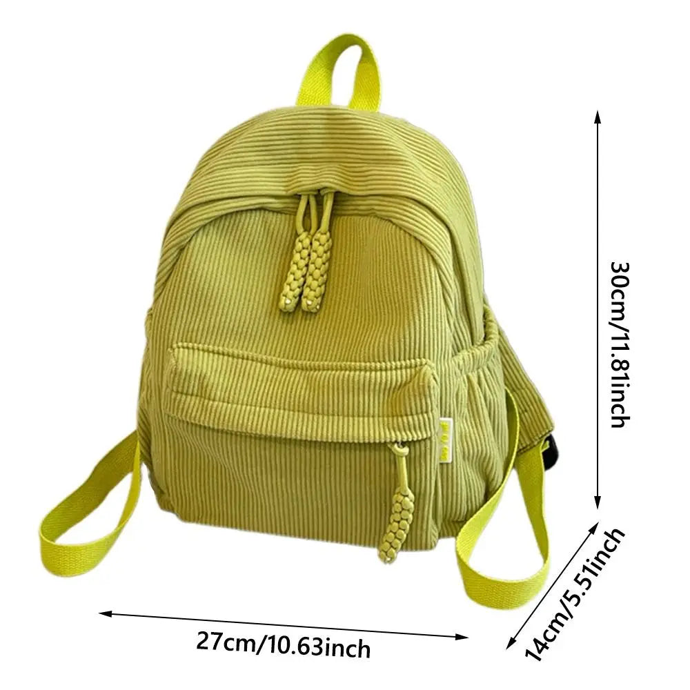 A light yellow corduroy daily backpack shown from the front.